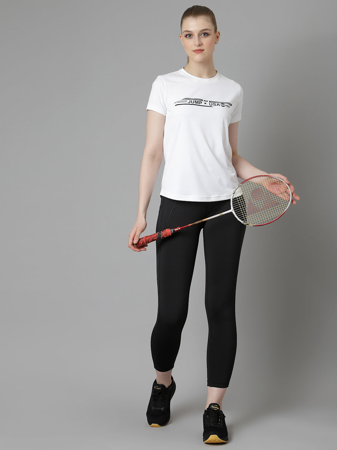 Premium Photo  A woman in a white t - shirt and black leggings